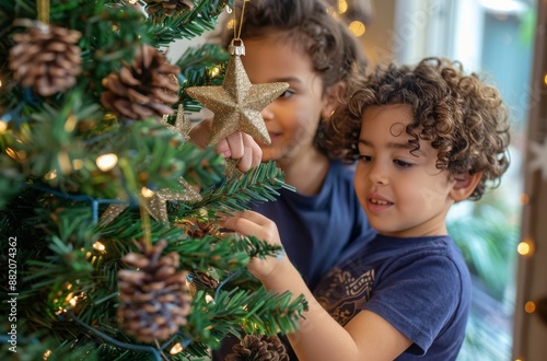 Young Girl Decorating Christmas Tree With Shiny Star Ornament