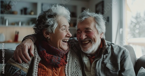Senior Couple Laughing Together Inside Home During Daytime
