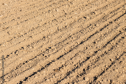 Wheel tracks on the soil, close-up of a tractor track