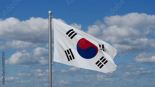 South Korea or Republic of Korea or ROK flag waying in the wind against the running clouds on blue sky, close-up flag video