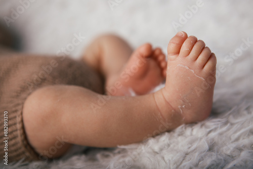 Newborn baby feet on the background