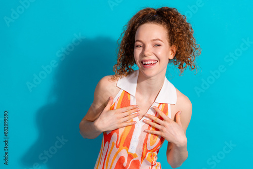 Photo portrait of lovely young lady point self laugh dressed stylish orange garment isolated on cyan color background photo