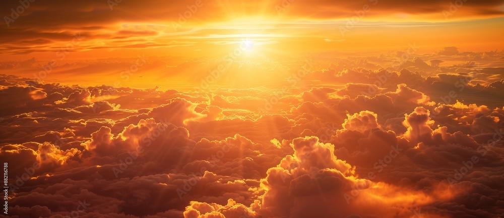 In the orange sky, golden clouds form an endless sunset, and sunlight shines through them on the earth below. In the orange sky, golden clouds form an endless sunset, and sunlight shines through them on the earth below.
