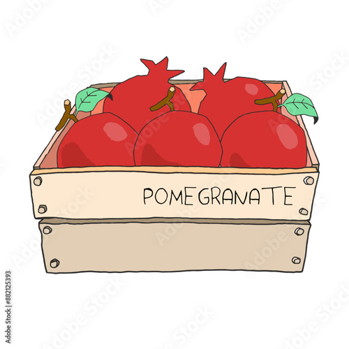 Fresh organic tropical red fruit pomegranate in a wooden box