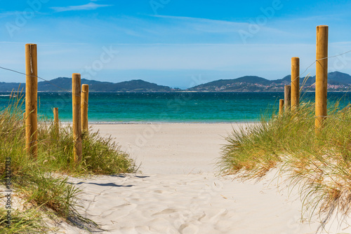 Path between the dunes of Samil beach in the Vigo estuary, in the background the region of Morrazo, Pontevedra. photo