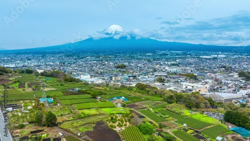 Hyper lapse,Aerial view of Mount Fuji in Japan and green tea fields during spring, Japan travel concept