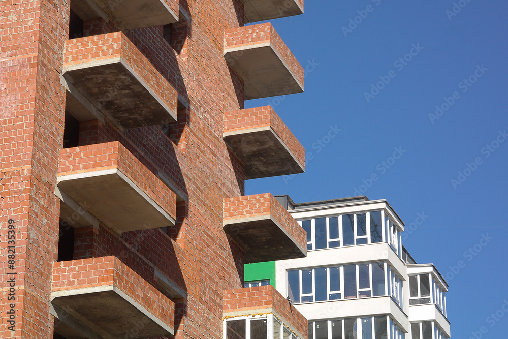 Construction of a new house against the blue sky. Construction of a new house against the blue sky.