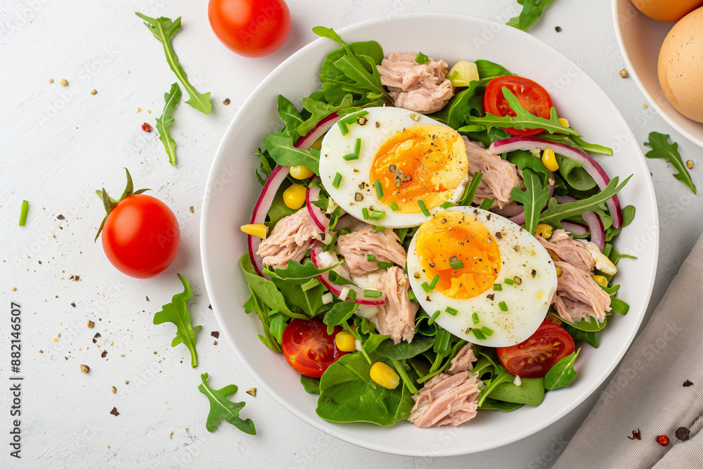 A salad with two eggs and tomatoes A salad with two eggs and tomatoes