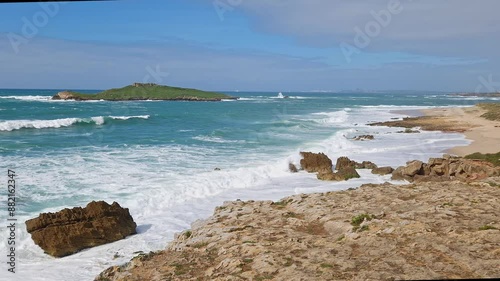 Pessegueiro Island, Ilha do Pessegueiro, literally island of the Peachtree, is a small island located along the southwest coast of Porto Covo, Portugal photo