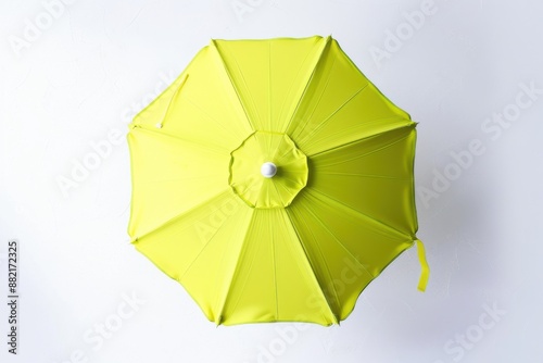 Top view of lemon lime beach umbrella isolated on white background. photo