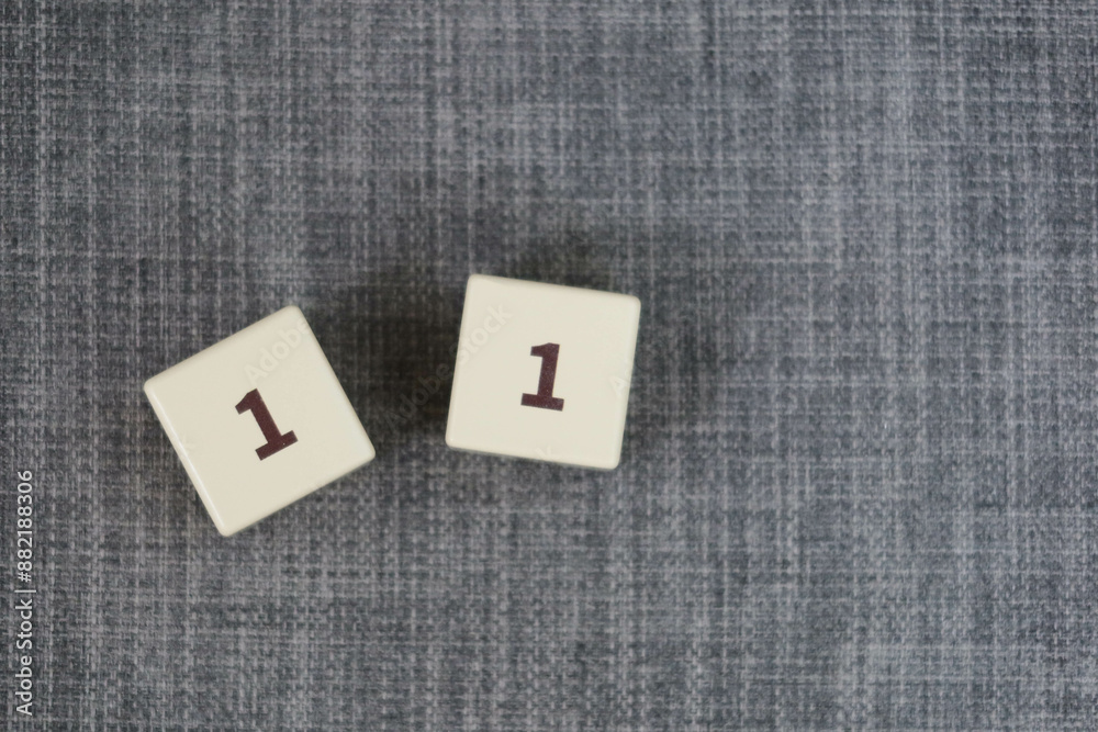 wooden cube block numbers eleven 11 on a grey background can be used as date and age wooden cube block numbers eleven 11 on a grey background can be used as date and age