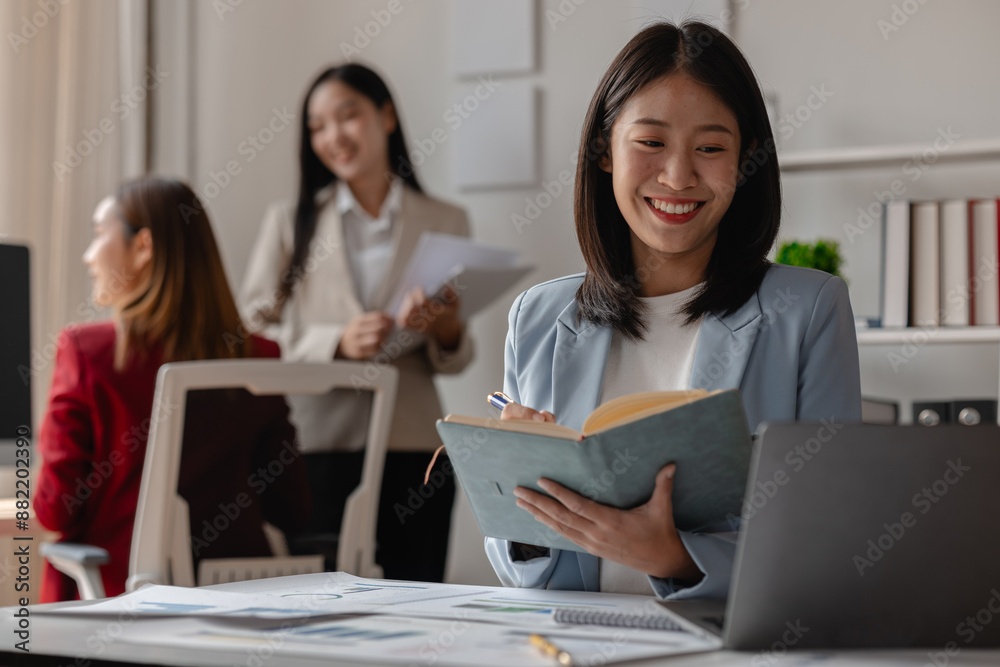 three businessperson are working in the modern office, group of employee has discussion about new project, working as teamwork is more effective, coworkers are brainstorming to planing great strategy