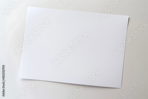 Blank sheet of white paper on an isolated background. Top front view of an empty page for mockup. AI generated.