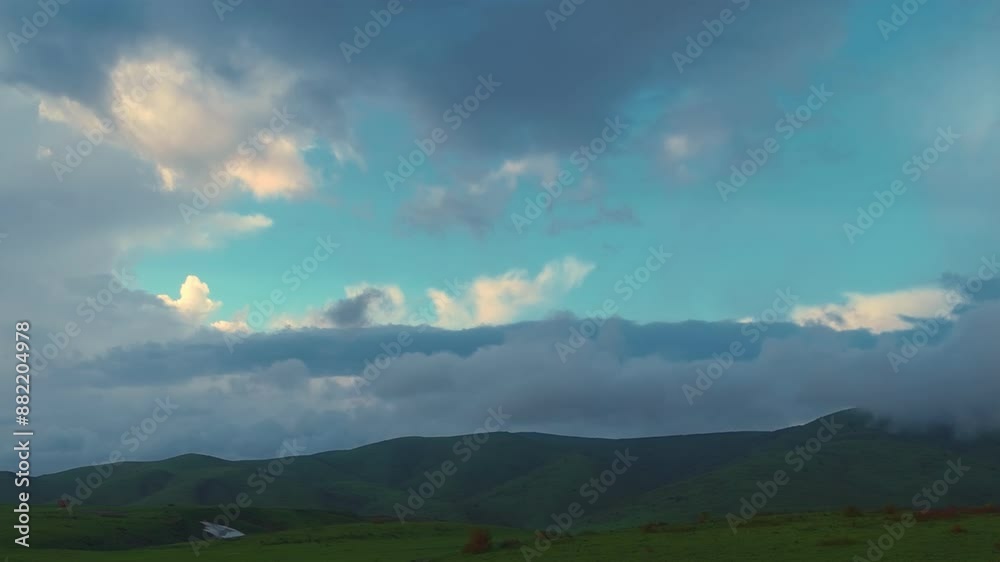 The evening before dark.The bright sky is painted in picturesque shades, reflecting the sunset light. The green field highlights the beauty of this scene, creating a perfect contrast with the landscap The evening before dark.The bright sky is painted in picturesque shades, reflecting the sunset light. The green field highlights the beauty of this scene, creating a perfect contrast with the landscap
