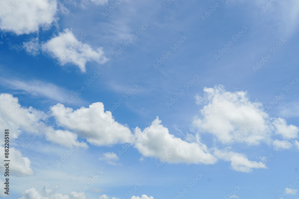 Blue sky with clouds in the sky. Beauty white cloudy on blue sky with soft sun light, Nature view soft white clouds on pastel blue sky background.