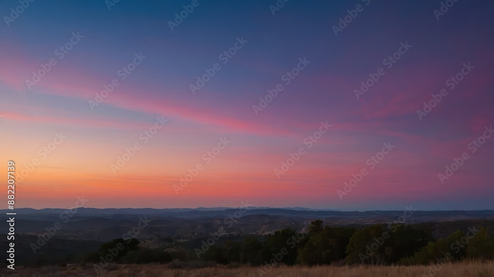 Fototapeta premium A scenic view of sunrise with vibrant colors in the sky, showcasing a serene and peaceful landscape ideal for nature appreciation and relaxation concepts