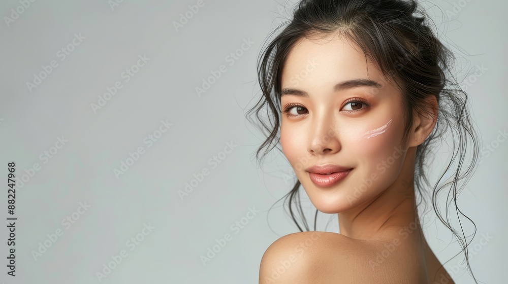 A tight shot of a woman's lined face, displaying numerous wrinkles on her cheeks Her hair is pulled back into a tidy bun A tight shot of a woman's lined face, displaying numerous wrinkles on her cheeks Her hair is pulled back into a tidy bun