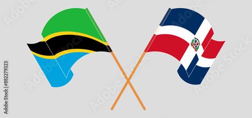 Crossed and waving flags of Tanzania and Dominican Republic. Vector illustration
