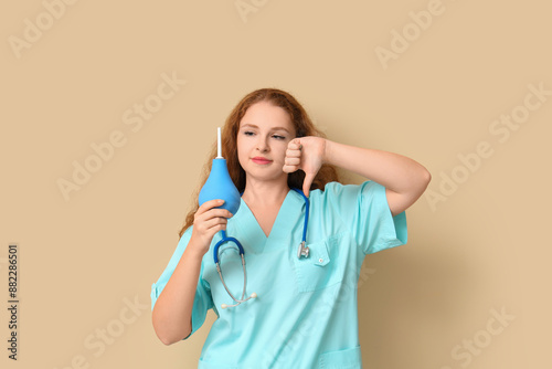 Female doctor with enema sh...