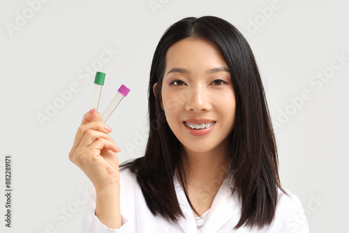 Asian woman holding empty t...