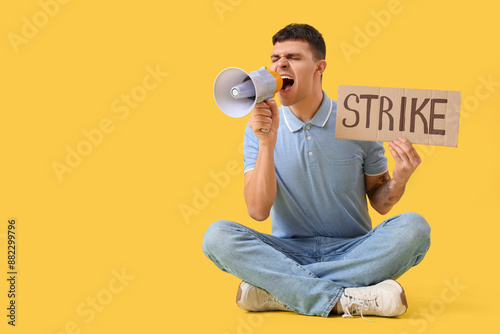 Protesting young man shouti...