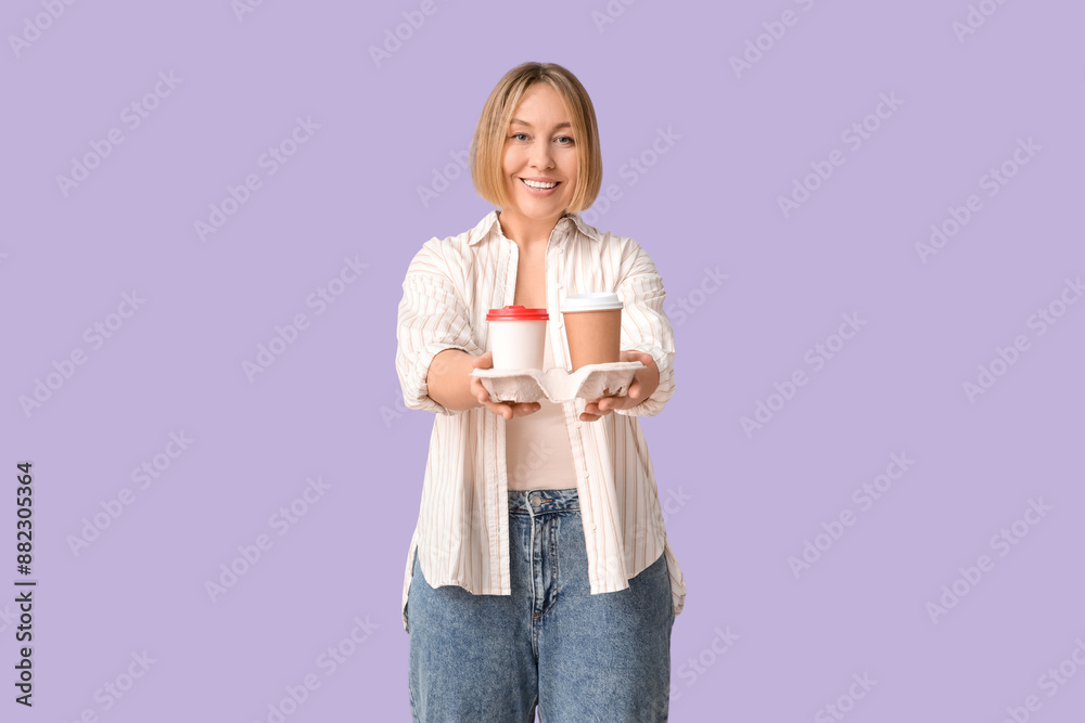 Happy adult woman with paper cups of coffee on lilac background Happy adult woman with paper cups of coffee on lilac background
