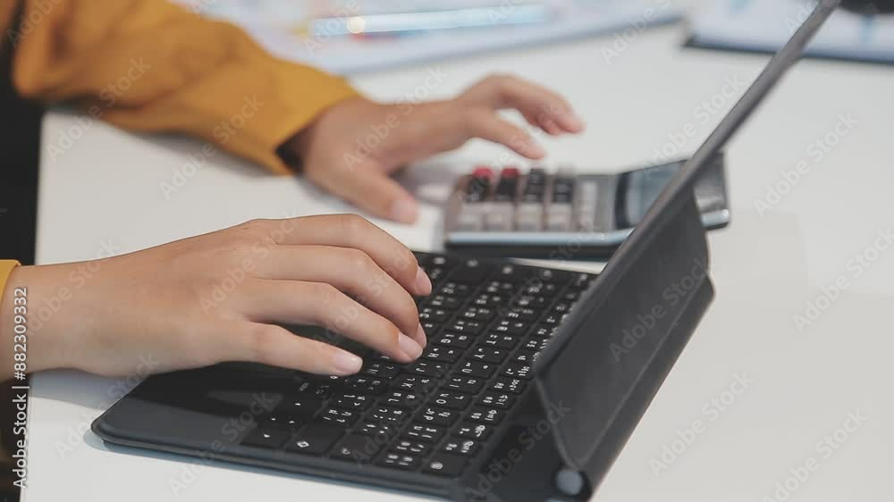 Cropped image of professional businesswoman working at her office via laptop, young female manager using portable computer device while sitting at modern loft, flare light, work process concept Cropped image of professional businesswoman working at her office via laptop, young female manager using portable computer device while sitting at modern loft, flare light, work process concept