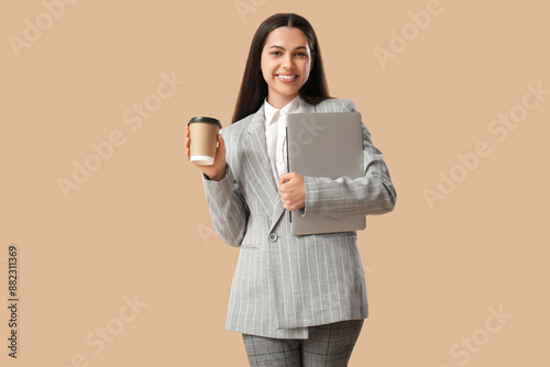 Pretty businesswoman with c...