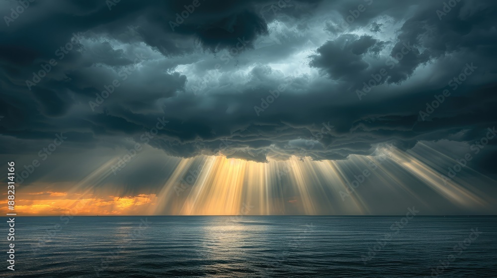 Sunlight breaking through storm clouds at sea Sunlight breaking through storm clouds at sea