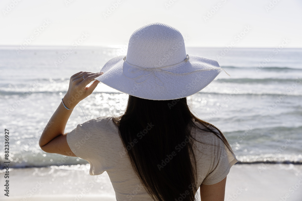 woman on the summer beach, enjoying view at sea woman on the summer beach, enjoying view at sea