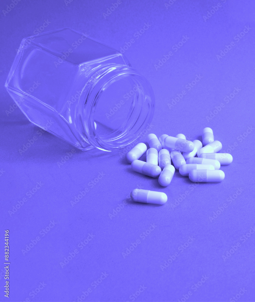 Close up, pills on the bottom and small container. Close up, pills on the bottom and small container.