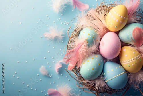 A close-up shot of a nest filled with colorful Easter eggs decorated with feathers