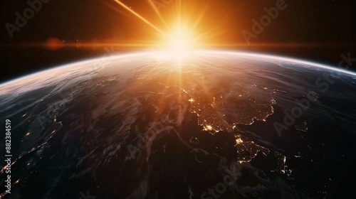 A view of the Earth from space, with the sun rising in the background