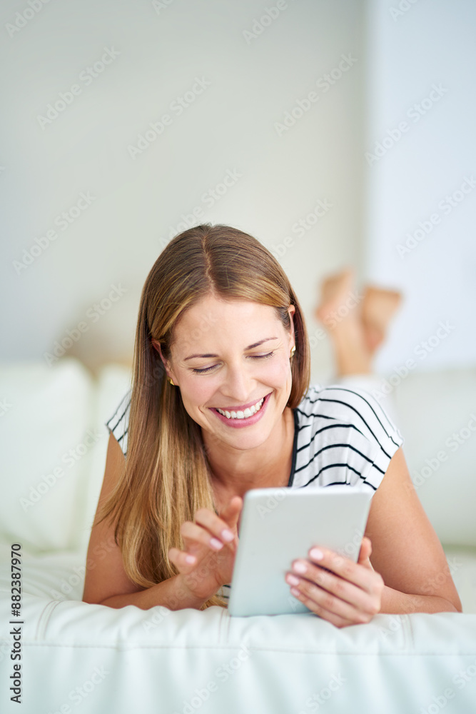 Woman, tablet and laugh for funny message in bedroom, reading comedy fiction and dating website. Female person, home and app for streaming movies or comic film, surfing social media and online games Woman, tablet and laugh for funny message in bedroom, reading comedy fiction and dating website. Female person, home and app for streaming movies or comic film, surfing social media and online games
