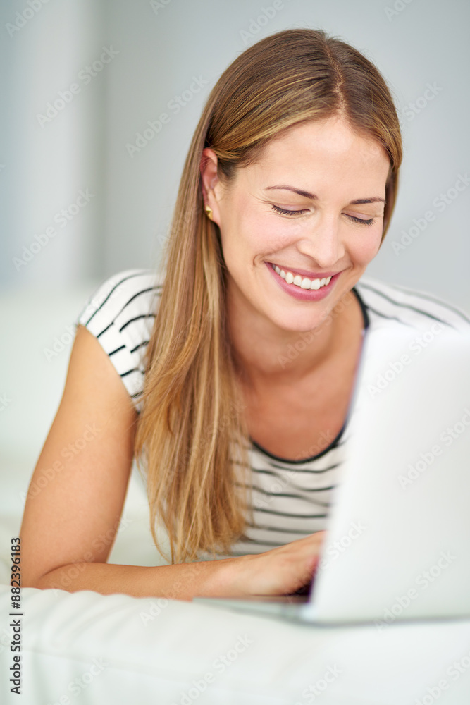 Woman, laptop and streaming online on sofa, typing and search for real estate opportunity or shopping. Female person, home and browse property website for apartment, relax and surfing social media Woman, laptop and streaming online on sofa, typing and search for real estate opportunity or shopping. Female person, home and browse property website for apartment, relax and surfing social media