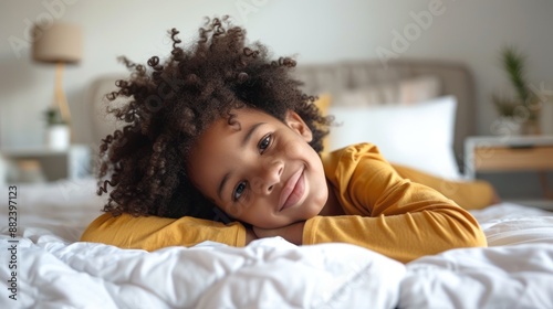 Smiling girl in bed