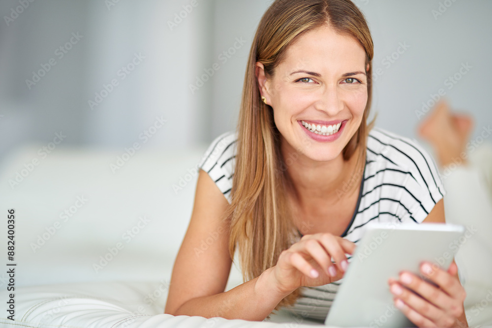 Woman, happy portrait and tablet for browsing with streaming film, playing online crossword and blog update in home. Lady smile, tech and post for social media, reading ebook and download game app Woman, happy portrait and tablet for browsing with streaming film, playing online crossword and blog update in home. Lady smile, tech and post for social media, reading ebook and download game app