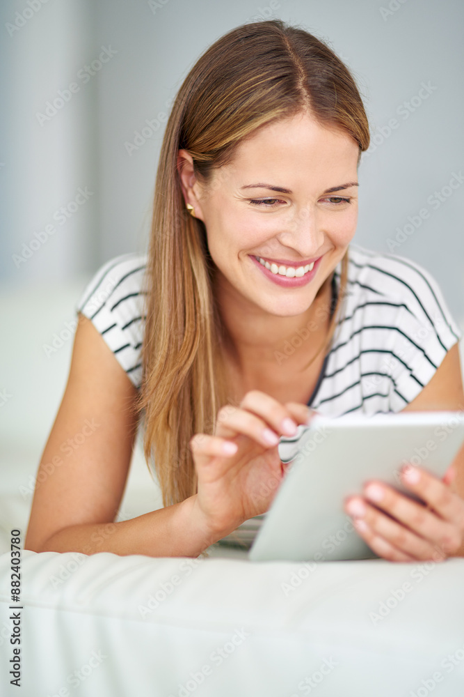 Woman, smile and tablet internet for browsing with streaming film, watching online video and blog update in home. Female person, tech and post for social media, reading ebook and series subscription Woman, smile and tablet internet for browsing with streaming film, watching online video and blog update in home. Female person, tech and post for social media, reading ebook and series subscription
