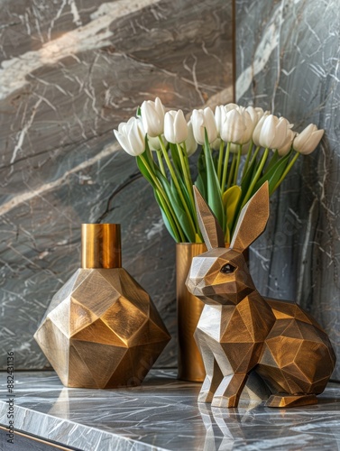 Golden Geometric Rabbit Figurine on Marble Tabletop With White Tulip Bouquet