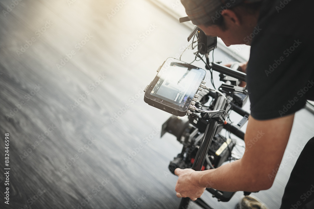 Videography, camera and man filming with screen for photography, production and media. Behind the scenes, backstage and person with stabilizing equipment on set shooting videos, documentary or film Videography, camera and man filming with screen for photography, production and media. Behind the scenes, backstage and person with stabilizing equipment on set shooting videos, documentary or film