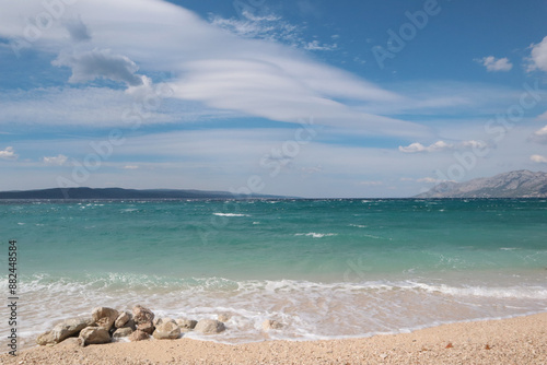 Fototapeta Naklejka Na Ścianę i Meble -  Picturesque beach during a storm on a cloudy day, Baska Voda, Croatia