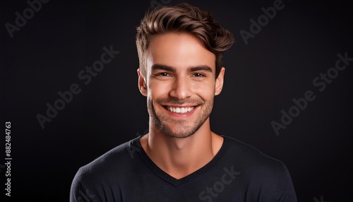 Smiling Young Man Against Black Background