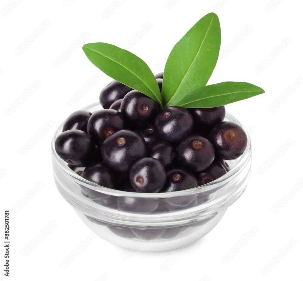 Fresh ripe acai berries in glass bowl and green leaves isolated on white Fresh ripe acai berries in glass bowl and green leaves isolated on white