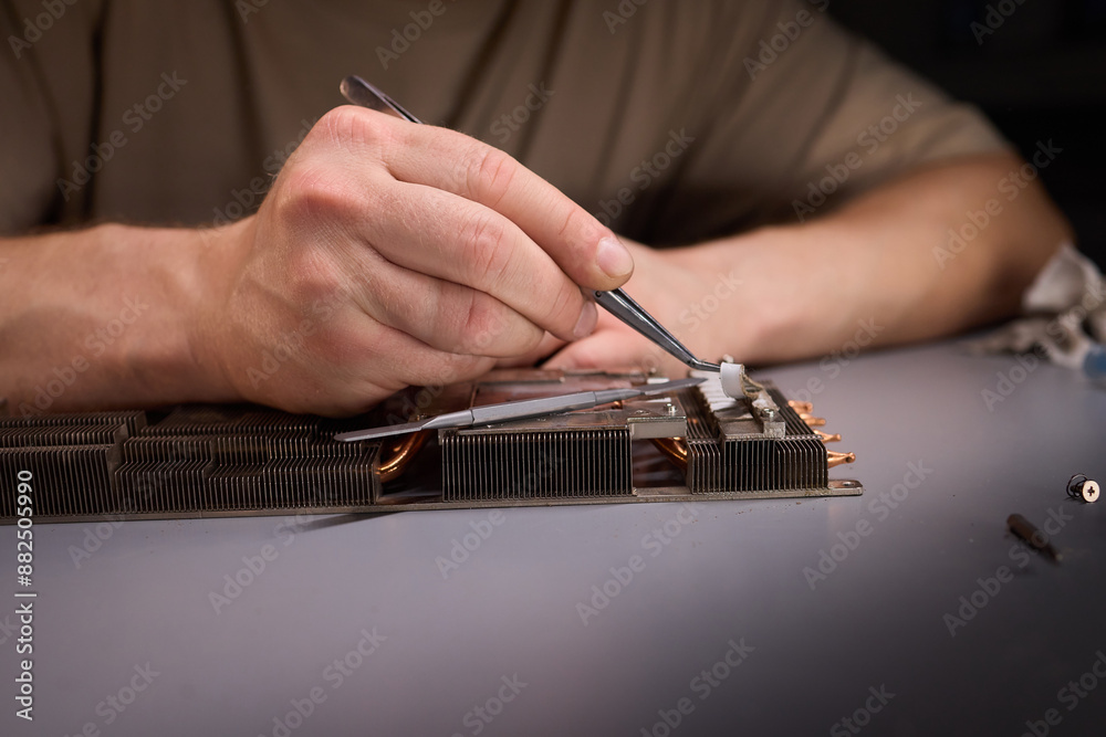 Picture of Using thermal paste is crucial for enhancing the cooling efficiency of ...