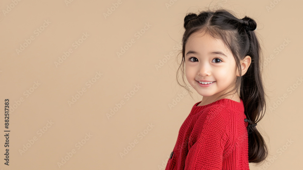 Malay girl in red sweater smile to copy space for text for advertising Malay girl in red sweater smile to copy space for text for advertising