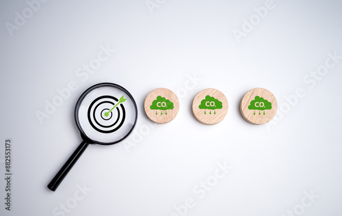 Net zero by 2050, Circle plank with green cloud icon and dartboard focus magnifying glass on white background, Net zero green house gas emissions target, Climate neutral long term strategy. photo