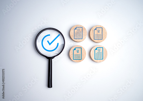 Document icon which print screen on wooden circle plank for prepare check and approve document, Quality assurance and ISO guarantee concept, Document management digital file data online. photo