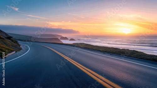 Stunning Coastal Highway at Sunset with Vibrant Sky and Ocean Waves Crashing Against the Shoreline