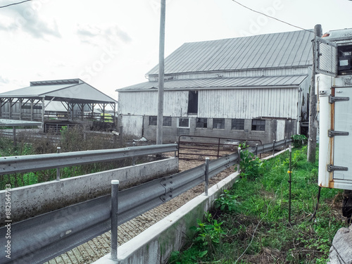 Farm Building With Walkway And Grenary On Both Sides photo