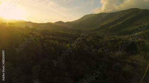 Wallpaper Mural Drone footage captures the awe-inspiring sunset over Bacungan, Palawan, illuminating the landscape in warm hues. Flying between mountains, it reveals the breathtaking beauty of the landscape. Torontodigital.ca